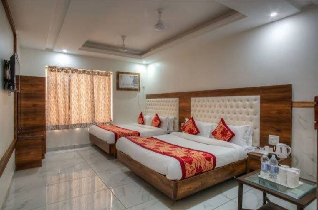 AC room at Niharika Bhavan with double bed and attached washroom